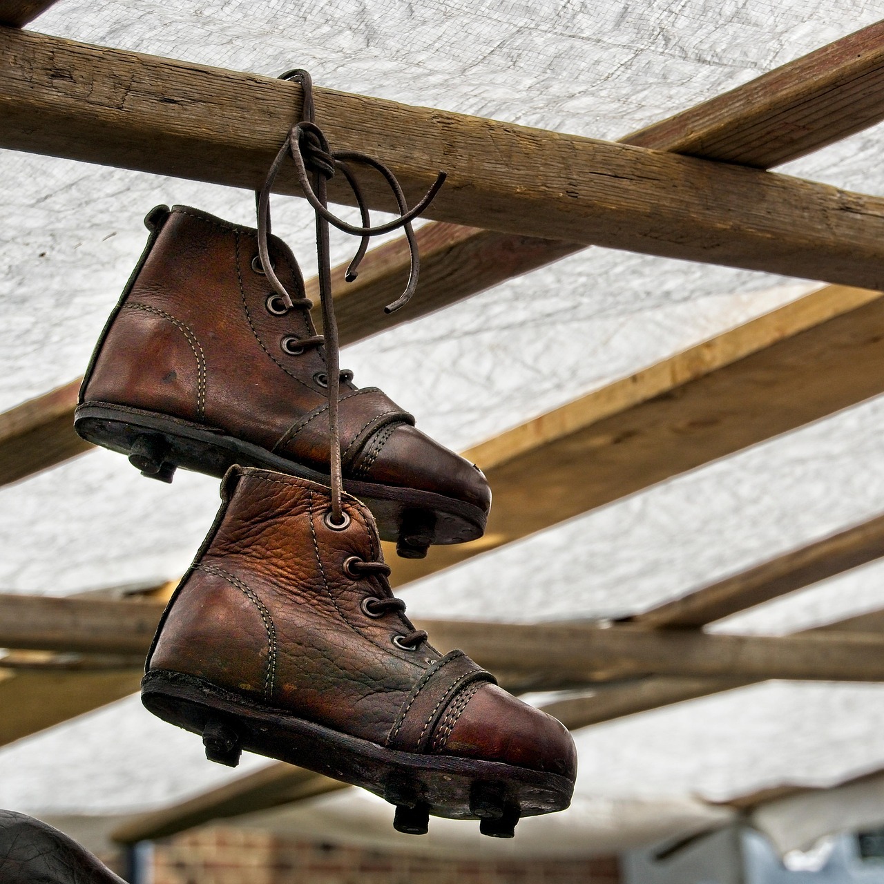 A row of worn brown vintage leather shoes